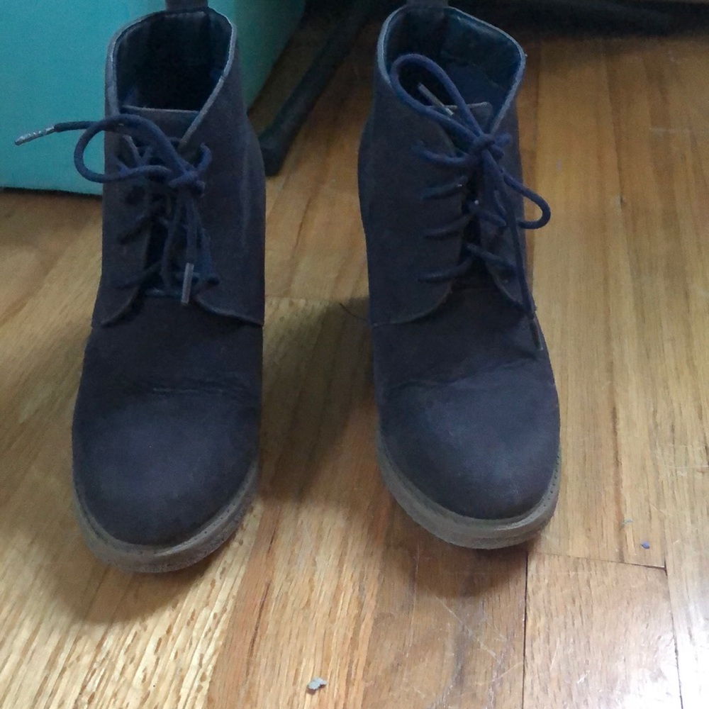 Black booties with blue laces